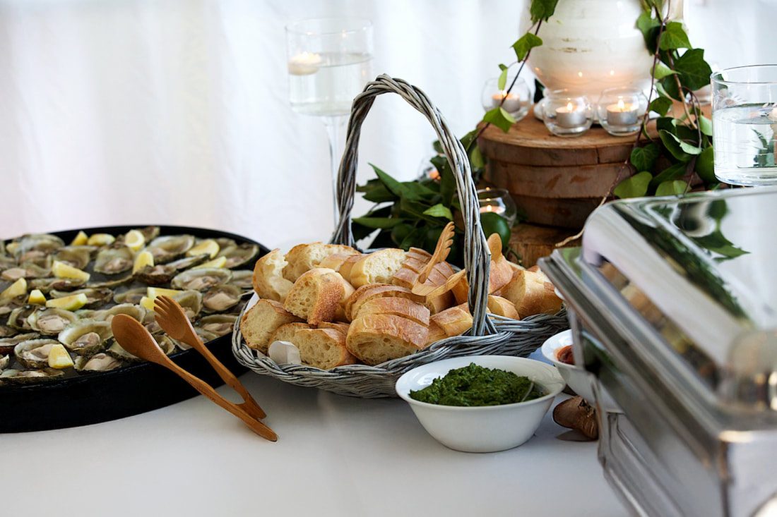 Seafood and fresh bread spread at an event