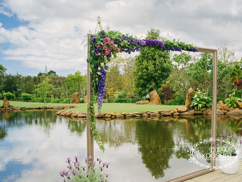 Floral arch beside the pond at Liddington Gardens